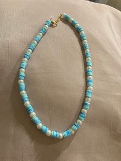 The clay beads can be more of a preppy style but this can also go along with a more blue and beachy aesthetic without the preppy. It's beachy and pretty and goes well with neutral colors (or really anything you want). Casual Blue Necklace With Colorful Beads, Handmade Turquoise Pearl Necklace For Beach, Blue Single Strand Beaded Necklace For Summer, Casual Blue Beaded Necklaces, Casual Blue Beaded Necklace For Vacation, Summer Beach Light Blue Beaded Necklaces, Summer Light Blue Beaded Necklaces For Beach, Blue Strand Necklace With Beachy Style, Beachy Blue Jewelry With Colorful Beads