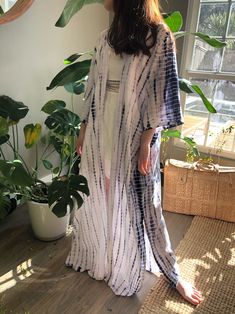 A beautiful handcrafted unisex kimono long robe dress by the hand tie-dye Removable waist tie closure Side slits at hem 100% Soft Rayon Hand wash in cold water, hang dry. Wear on the beach when on the vacation as well home Sizes: One size -One size fit all (Very oversized) Chest & Hip: 66 inches. Length: 54 inches. 🧍🏻‍♂️Tan: Model height is 188cm/6.2ft, (37-31-34") 🧍🏽‍♀️Ginger: Model height is 158cm/5.2ft, American small size (31-25-33") - Each piece is handmade, and due to the nature of Bohemian Wrap Dress For Day Out, Casual Wrap Maxi Dress For Beach, White Bohemian Wrap Dress, Bohemian Wrap Dresses For Vacation, Spring Beach Cover-up Maxi Dress With Kimono Sleeves, Spring Maxi Dress With Kimono Sleeves For Beach Cover-up, White Bohemian Maxi Kimono, White Bohemian Maxi Length Kimono, Flowy Long Breezy Cover-up