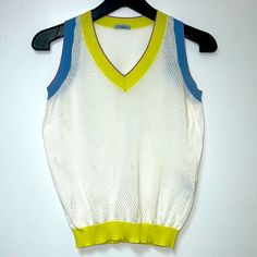 Nwot Malo Italy Sleeveless Summer Crop Top In White With Blue And Yellow Trim. Perforated Super Light 100% Fabric. V-Neck Front Opening. Made In Italy. Size S. New, No Tags Retro V-neck Vest For Spring, Green V-neck Sweater Vest For Summer, Retro Green Sleeveless Tank Top, Summer Sleeveless Sweater Vest, Summer White V-neck Vest, White V-neck Summer Vest, Casual Yellow V-neck Vest, Retro Spring Tank Top, Summer Multicolor V-neck Sweater Vest