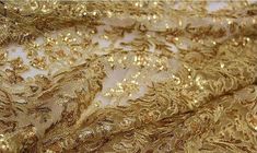 gold lace fabric, gold lace , alencon lace in gold, wedding dress lace, gold fabric lace, fabric by Festive Gold Lace With Lace Work, Gold Sequined Lace For Party, Party Gold Lace With Sequins, Gold Sequin Fabric With Zari Work For Party, Gold Embroidered Lace Fabric, Elegant Gold Sequin Fabric With Zari Work, Gold Lace Sequin Fabric With Lace Work, Elegant Gold Embroidered Fabric With Lace Work, Gold Embroidered Fabric For Party