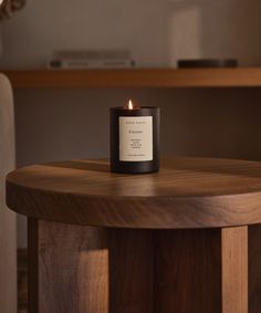 a candle sitting on top of a wooden table