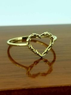 Barbed wire Heart ring in 14k gold.  this is a very dainty cute ring ideal for women or girls. The size is adjustable.  Anillo de corazon con picos en oro 14k. este anillo es muy sencillo pero muy bonito. ideal para mujer o ninas. es size es ajustable viene con una cajita de regalo. Barbed Wire Heart, Wire Heart, Cute Ring, Barbed Wire, Rings Statement, Favorite Jewelry, Statement Rings, Heart Ring, Beauty Book