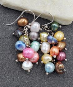 Lovely, Estate 925 Sterling Silver Multi Color Freshwater Pearl Cha Cha Dangle Earrings.  These beautiful earrings are sure to receive many compliments!  SOLID925 STERLING SILVER HOOKS, CHAIN IS NOT STERLING.  Length: 2"  Width: 5/8"  Gemstone: Dyed Freshwater Pearl  Weight: 10.9 Grams  Hallmarked: no mark / fully tested  We gladly combine shipping!  Everything is packed with care to make sure it arrives safely.  We only sell authentic items. If it is a name brand item, we guarantee it to be aut Silver Dangle Pearl Earrings With High Luster, Multicolor Pearl Earrings As A Gift, Multicolor Pearl Earrings Set As A Gift, High Luster Silver Dangle Jewelry, Multicolor Dangle Pearl Earrings, Multicolor Pearl Drop Earrings For Gift, Multicolor Dangle Pearl Earrings For Pierced Ears, Silver Drop Earrings With High Luster, Hypoallergenic Multicolor Sterling Silver Earrings