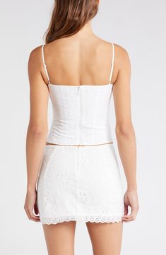 Decorative tonal embroidery adds to the charm of this corset-inspired top made with a hint of stretch for a curve-hugging fit. 12 1/2" length (size Medium) Hidden back-zip closure Square neck Adjustable straps Lined 65% polyester, 32% cotton, 3% elastane Dry clean Imported Lace Top With Sweetheart Neckline, White Tops With Corset Back, Elegant Fitted Cotton Crop Top, Sleeveless Fitted Corset For Spring, Fitted Sleeveless Corset For Spring, Fitted Sleeveless Spring Corset, Fitted Lace Tops With Sweetheart Neckline, White Tops With Fitted Bodice, Spring Lace Top With Corset Back