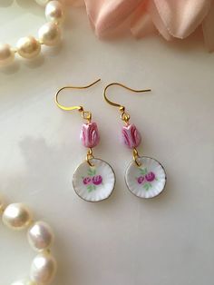 "Handmade pink floral teacup saucer earrings with pink Czech glass tulips. The mini porcelain plates measure approximately 1/2\" in diameter." Tea Cup Earrings, Tulip Earrings, Floral Teacup, Porcelain Earrings, Party Earrings, Porcelain Plates, Earrings Vintage, Tea Cup Saucer, Cute Earrings