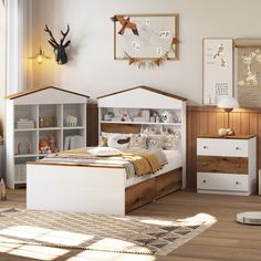 a child's bedroom with white and wood furniture, deer head on the wall