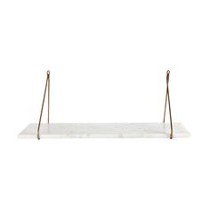 a marble shelf with two brass handles