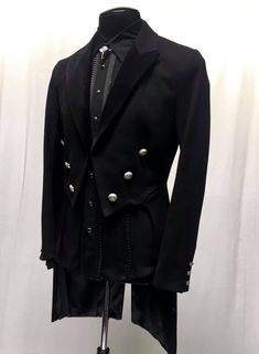 "A formal Victorian coat with tails. Great for special occasions, formal events, or when you want to stand out from the crowd. Heavy brushed black denim fabric with luxurious black velvet lapels. Fully lined in rich black satin. Six ornate metal buttons decorate the front and two at the waist in back. Three smaller metal buttons are at each cuff. Comes in sizes small-XXXL. I love this one!! Measurements: Small - Chest 40\" Waist 30-34\" Medium - 42-44\" Waist 32-38\" Large - Chest 46\" Waist 36- Black Single Breasted Tuxedo For Party, Black Single-breasted Tuxedo For Party, Black Single-breasted Party Tuxedo, Tailored Black Tuxedo For Winter, Black Winter Tuxedo, Black Tuxedo For Semi-formal Occasion, Black Double-breasted Tuxedo For Semi-formal Occasions, Black Double-breasted Semi-formal Tuxedo, Black Double-breasted Evening Blazer