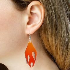 Ignite your style with our eye-popping BUNNYBOOP Y2K Red Flame Acrylic Earrings! These aren't just earrings; they're conversation starters, designed to add a spark of joy and a blaze of personality to any look. Made with dazzling love and fiery passion, each piece is a vibrant red flame, crafted from the highest quality acrylic for a lightweight, comfortable wear all day long. Dive deep into the playful side of the millennium with these funky and funny earrings that scream uniqueness. Ideal for Trendy Red Jewelry For Halloween, Trendy Red Halloween Jewelry, Trendy Halloween Earrings, Fun Red Jewelry For Halloween, Red Fun Halloween Jewelry, Fun Red Halloween Jewelry, Earrings Stand, Funny Earrings, Quirky Earrings