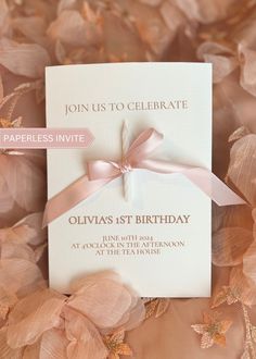 a pink and white wedding card with a ribbon on it