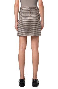 A professorial houndstooth plaid gets its untailored reputation elegantly countered by the polished cut of this skirt flared at the front by box pleats. Hidden back-zip closure 100% virgin wool Dry clean Made in Romania Designer Clothing Formal Fall Tweed Skirt, Formal Tweed Skirt For Fall, Chic Houndstooth Skirt For Work, Elegant Houndstooth Mini Skirt For Work, Houndstooth Mini Skirt For Work, Fall Tweed Mini Skirt For Work, Tweed Mini Skirt For Fall Workwear, Plaid Houndstooth Skirt For Fall, Elegant Plaid Mini Skirt For Work