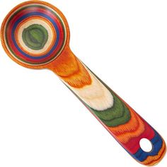 an orange, green, and blue striped spoon on a white background