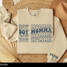 "Wrap yourself in cozy comfort and celebrate motherhood with our custom Boy Mom sweatshirt, the perfect personalized gift for first-time or expecting moms. An ideal postpartum or Mother's Day treat, this sweatshirt is designed for you to embrace the \"Boy Mom Era\" in style. SIZING -If you are looking for an over-sized look please size up 1-3 sizes from what you normally wear. -Please see sizing chart -These are unisex shirts, this means they will have a loose fit **I do not accept returns or exchanges due to sizing issues - please reference sizing chart in product images prior to purchase PRINT COLOR & SIZING -Please be aware, the color of the print in the shirt may vary slightly from what you see on your screen due to differences in display types. Apparel is made to order using Direct to Family Matching Sweatshirt With Name Print For Mother's Day, Casual Letter Print Sweatshirt For Gender Reveal, Cotton Letter Print Sweatshirt For Gender Reveal, Casual Sweatshirt With Custom Text For Mother's Day, Boy Mom Sweatshirt, First Time Mom, Mom Era, First Time Moms, Mom Sweatshirt