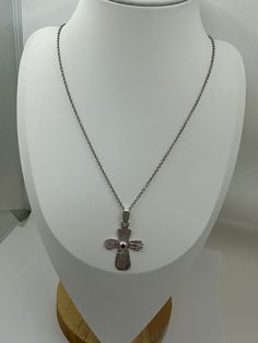 A Divine Fusion: Cross and Garnet Embrace the divine with our Argentium Silver Cross Pendant adorned with a small, precious Garnet. This pendant is a harmonious blend of faith and elegance, meticulously crafted to resonate with those seeking spiritual connection and refined style. The deep red hue of the Garnet beautifully complements the radiant silver, creating a captivating focal point. Key Features: Handcrafted with 925 Argentium Silver for enduring quality and shine. Small Garnet gemstone c Elegant Nickel-free Jewelry For Meditation, Spiritual White Gold Cross Pendant Necklace, Spiritual Cross Pendant Necklace For Formal Occasions, Formal Spiritual Crucifix Jewelry, Symbolic Formal Necklace With Large Pendant, Formal Symbolic Necklace With Large Pendant, Spiritual White Gold Cross Jewelry, Symbolic Necklace With Large Pendant For Formal Occasions, White Gold Cross Jewelry For Spiritual Style