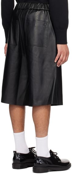 Grained lambskin shorts. · Elasticized waistband · Four-pocket styling · Mock-fly · Full cotton serge lining · Logo embossed at back pocket Supplier color: Black Black Leather Bottoms With Built-in Shorts, Classic Knee-length Leather Bottoms, Black Leather Knee-length Bottoms, Knee-length Black Leather Bottoms, Ami Paris, Black Body, Leather Shorts, Back Pocket, Paris