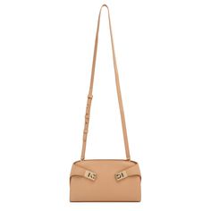 Light brown leather crossbody bag from Ferragamo. The Hug bag is made of light brown leather with an adjustable shoulder strap that detaches, enabling it to be worn as a clutch.Measurements: L22 x H14 x W11,5 cmMade in Italy Beige Baguette Bag With Adjustable Strap For Evening, Beige Evening Baguette Bag With Adjustable Strap, Evening Beige Baguette Bag With Adjustable Strap, Brown Crossbody Baguette Bag With Adjustable Handle, Brown Shoulder Bag With Adjustable Handle For Evening, Evening Brown Baguette Bag With Adjustable Strap, Brown Evening Shoulder Bag With Adjustable Handle, Beige Leather Baguette Bag With Adjustable Strap, Brown Leather Clutch With Detachable Strap