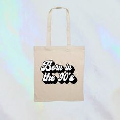 "90s Tote, retro style nineties born in the 90's tote bag 1990s birthday gift This retro tote bag makes a stunning gift for anyone \"Born in the 90's\". Natural cotton canvas tote which makes a great, custom eco-friendly gift. Printed in permanent vinyl, in a colour of your choice, with a stunning bold retro font. Posted with 1st Class Royal Mail. My designs are created and printed with love and care. For more of these designs and various gifts, you can visit my shop here: https://www.etsy.com/uk/shop/ElibelleAccessories" Retro Font, Eco Friendly Gifts, Permanent Vinyl, Star Print, Friends In Love, Uk Shop, Canvas Tote, Retro Style, Natural Cotton