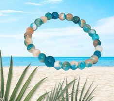 This simple, yet gorgeous stretch bracelet is made with natural jade, white, blue and peach round, smooth 6 mm beads. It is the perfect bracelet for the beach and for those warm summer days🏝☀️🏝☀️.  This is a stretch bracelet made with 100% polyester stretch cord (not wire). Please refer to the last picture when ordering your bracelet size. BEAD COLORS WILL VARY WITH EACH BRACELET!  The matching necklace (sold separately) is available in my Etsy shop. Beach Stretch Bracelet With Gemstone Beads, Stretch Bracelet With Gemstone Round Beads For Beach, Beach Stretch Bracelet With Round Gemstone Beads, Bohemian Stretch Bracelet For Beach, Bohemian Round Stretch Bracelet For Beach, Natural Stones Stretch Bracelet With Round Beads For Beach, Vacation Stretch Bracelet With Round Beads, Hand-strung Crystal Bracelet With Round Beads For Beach, Beach Bracelet