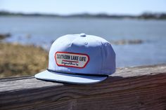 Expertly crafted: SLL PATCH SKY BLUE ROPE HAT is a durable and comfortable cotton/poly blend with a plastic snapback for an adjustable fit. With UPF 50+ and water repellent properties, this hat protects from the sun and water while showcasing the OG SLL PATCH design.   * Cotton/Poly Blend *  Plastic Snapback * UPF 50+ * Water Repellent Blue Flat Brim Snapback Hat For Summer, Adjustable Light Blue Outdoor Hats, Casual Light Blue Hat For Outdoor, Casual Light Blue Outdoor Hats, Blue Snapback Hat For Summer Outdoor Activities, Blue Cotton 5-panel Snapback Hat, Blue Trucker Hat For Camping, Blue Snapback Hat For Outdoor Activities, Outdoor Blue Snapback Trucker Hat