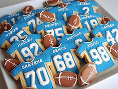 decorated cookies in the shape of footballs and numbers