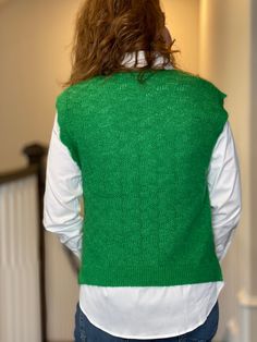 The vintage feel of this classic sweater vest is our current obsession and will be yours too. The bold green looks beautiful all season long. Wear with our Essentials Icon Shirt for a classic look. 5% Wool, 92% recycled polyester, 3% elastane Cathleen is 5’4” wearing a small/medium Trendy Green V-neck Sweater Vest, Trendy Green Sweater Vest For Winter, Chic Green Stretch Vest, Spring Green Knit Vest, Trendy Green Knit Sweater Vest, Green Knit Vest Top, Green Sleeveless Knit Vest, Green Knit Crew Neck Sweater Vest, Green Knit Sleeveless Vest