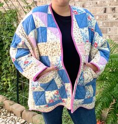 Handmade Quilt Coat Women's Size XL Very Popular With the Trending Clothing Style Right Now AND Very Comfortable to Wear  We Sew Our Coats from Vintage Quilts that we've Found from Either Thrift Stores or Estate Sales All of the Quilts are PRE-LOVED so it's common for them to have Small Stains, Rips, or Tears from Years Past.  We Personally Sew Each Coat, adding Bias to the Edges, for a Nice Clean Look, and to hold up in the Washing. No Buttons or Ties, Simply Toss On & Go! Each Coat has 2 Large Front Pockets. MEASUREMENTS: Coat is a Size XLarge according to the Pattern  Shoulder to Shoulder: 17 1/2" Underarm to Underarm: 31" Shoulder Seam to Bottom Hem Length: 25" Pocket: 9 1/2" X 12 CARE: Cold Water Gentle Cycle Wash  Toss in Warm Dryer or Hang to Dry  All of Our Reworked/Altered/Handmad Vintage Outerwear With Floral Patchwork, Oversized Patchwork Outerwear With Long Sleeves, Oversized Patchwork Long Sleeve Outerwear, Oversized Long Sleeve Patchwork Outerwear, Oversized Multicolor Patchwork Outerwear, Quilted Clothing, Quilt Coat, Vintage Quilt, Trendy Boho