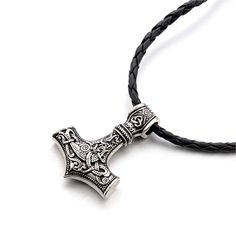 an old style hammer pendant on a black leather necklace with silver accents and intricate designs