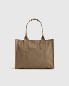 Our Organic Canvas Large Tote is a versatile everyday carryall designed to meet all your needs. This spacious canvas tote features a secure zip closure, multiple pockets, and ample room for your daily essentials. Crafted from GOTS-certified organic cotton and featuring a water-resistant coated lining, this piece prioritizes both responsibility and durability.  | Quince | Women's Organic Canvas Large Tote in Vintage Olive, Organic Cotton Cheap Neutral Tote Shoulder Bag, Cheap Tote Diaper Bag, Cheap Tote Diaper Bag For Shopping, Best Work Bag, Teacher Tote, Utility Tote, Work Tote, Travel Tote Bag, Black Sand