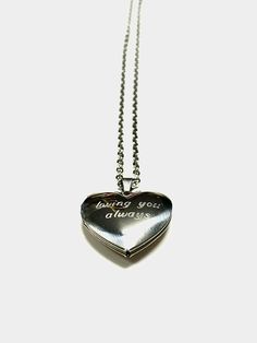 "The Stainless steel heart locket captures your love story in a polished and timeless way. Beautifully engraved with your unique message, it makes a heartfelt gift for your wedding day or special anniversary. With a stainless steel construction and lobster clasp closure, this locket will last forever. Pendant with chain length: 45cm/18\" + 5cm/2\". Weight:5g **No refunds for customized items unless the order was damaged in shipping or has an error. **We do not refund shipping charges or pay for Silver Double Heart Locket Necklace, Silver Heart Pendant Locket Necklace, Personalized Silver Heart Cut Locket Necklace, Silver Laser Engraved Jewelry For Anniversary Gift, Double Heart Stainless Steel Necklace For Anniversary, Engraved Stainless Steel Jewelry For Valentine's Day, Laser Engraved Silver Jewelry For Anniversary Gift, Engraved Stainless Steel Heart Pendant Jewelry, Valentine's Day Laser Engraved Stainless Steel Jewelry