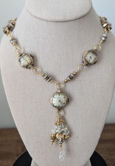 This  necklace has 5 beautiful vintage watches, at least one of which is stamped 10K gold plated bezel. Dangling form the center watch are gold filled beads as well as silver tone beads and some clear crystals for sparkle. Links that I made to separate the other watches are also comprised of gold tone, gold filled and silver beads. The clasp is a large lobster claw clasp. This one is stunning! These necklaces make a statement and are perfect for anyone who loves vintage or steampunk style. Wear one on its own for a simple and elegant look, or pair with one of my bracelets and earrings to create a bold and eye catching outfit. Add a touch of time-worn charm to your jewelry collection! **I welcome custom orders! If you have something special from a loved one that I can incorporate into a des Clock Earrings, Time Costume, Sundance Style, Vintage Jewelry Crafts, Necklace Ideas, Steampunk Style, Clear Crystals, Steampunk Fashion, Jewelry Cleaner