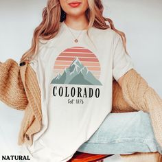 This Retro Colorado mountain shirt is super soft and cozy. Perfect to lounge around, run errands, or walk your dog. ABOUT THIS SHIRT   ∙ Shirt is UNISEX and runs slightly large for ladies (For a relaxed fit, I suggest your usual size. For an oversized fit, I suggest sizing up 1 to 2 sizes.) ∙ Solid Colors: 100% airlume ringspun cotton, Dark Grey Heather: 52% cotton, 48% polyester, Athletic Heather 90% cotton, 10% polyester ∙ Colors may vary based on your monitor/screen display or lighting CARE I Colorado Shirt, Colorado Outfits, Crewneck Vintage, Adventure Gifts, Mountain Shirt, Colorado Mountain, Clothing Apparel, Outdoor Adventure, San Jose