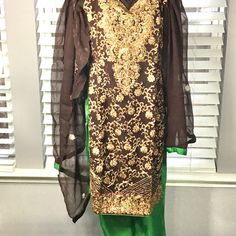 This Is A Brand New Item # (03-0120-1s1l)) With Tag Pakistani Indian Style Heavy Embroidered Party Dress For Any Special Occasion. You Can Also Give It As A Gift To Family And Friends.The Shirt Has Heavy Embroidery In The Front And Back And The Trouser Is Green Printed Satin With Fancy Embroidered Bottom.It Comes With The Chiffon Dupatta And The Dupatta Has Embroidery In Multi Colors. Small Shoulder 13”, Chest 34”, Waist 30”, Hip 38” Medium Chest 38” Waist 34” Hip 40” Large Chest 40”, Waist 36”, Party Sets With Intricate Embroidery On Shantoon, Embroidered Fitted Salwar Kameez In Shantoon, Brown Resham Embroidered Sets For Diwali, Brown Sets With Resham Embroidery For Diwali, Brown Resham Embroidery Sets For Diwali, Festive Brown Party Sets, Fitted Kurta With Intricate Embroidery In Shantoon, Fitted Shantoon Kurta With Intricate Embroidery, Fitted Embroidered Unstitched Suit In Shantoon