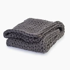 a gray blanket folded on top of each other