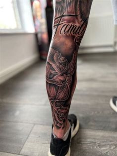 a man's leg with tattoos on it and the words family written in black ink