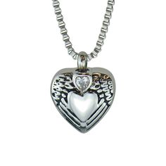 "This beautiful piece of high quality jewellery is designed to hold a tiny amount of a loved one or pet's ashes, ensuring that there is always a part of them held close to your heart. This solid 316L Stainless Steel pendant is in the shape of a heart with angel wings and a clear Czech crystal. Measuring approximately 1.8cm/0.71\" in overall height and 1.8cm/0.71\" in width. The high quality solid 316L Stainless Steel 'box' chain measures approximately 51cm (20\").  Each Pendant comes beautifully Silver Spiritual Heart Cut Jewelry, Double Heart Charms Jewelry For Keepsake, Double Heart Charms Keepsake Jewelry, Double Heart Keepsake Charms Jewelry, Spiritual Keepsake Jewelry With Charms, Keepsake Double Heart Charms Jewelry, Heart Cut Birthstone Necklace For Keepsake, White Gold Stainless Steel Jewelry For Anniversary, Heart-shaped Keepsake Charms Jewelry