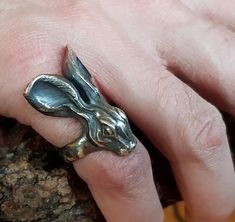 Sterling silver Hare ring. This is a real statement ring! Really stunning on the hand and works well for a man or a woman. Original design carved in wax then lost wax cast into solid sterling silver. Large piece which weighs approximately 25g. Also available oxidised/blackened as shown in photograph. Shown in a size P, and adjustable to ring sizes A-Z6 (£10 supplement charged for sizes T and larger). First class post included. Unique Hand Cast Sterling Silver Engraved Ring, Unique Rings With Lost Wax Casting As Gift, Artistic Hand Cast Sterling Silver Rings, Unique Hand Forged Engraved Ring For Gift, Unique Sterling Silver Engraved Ring, Unique Handmade Open Engraved Ring, Unique Collectible Engraved Ring With Lost Wax Casting, Unique Handmade Engraved Ring As A Gift, Unique Engraved Ring With Lost Wax Casting For Collectors