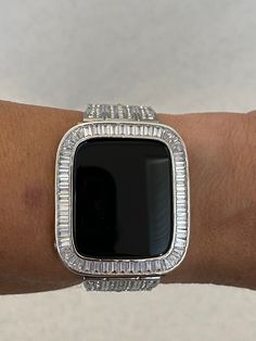 Fits the Apple Watch available for sizes 38mm 40mm 42mm 44mm in series 2,3,4,5,6 or SE. Silver Baguette Metal Apple Case Cover 40mm or 44mm Women Mens Style. Iwatch Band Custom Bezel with Baguette Lab Diamonds set in 14k white gold plating. Fits Series 4,5,6,SE. Custom plated in 14k White Gold and set with high quality lab diamonds. Listing is for the bezel only band in video and photos is not included. For band color selections click the appropriate link Silver Bands: https://etsy.me/3eKmPT0 Go Silver Apple Watch, Silver Apple, Gadgets Electronics, Smart Jewelry, Ceramic Watch, Apple Watch Case, Apple Watch Accessories, Apple Cases, Black Cover