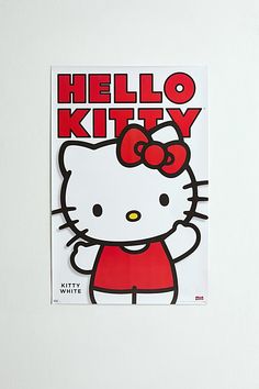 a hello kitty sticker on the side of a white wall