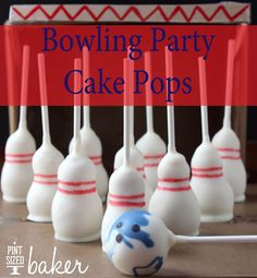 some cake pops are lined up on a table with the words bowling party cake pops