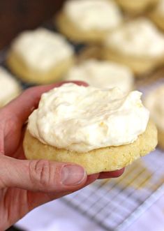 a hand holding a cookie with frosting on it and the words dole whip cookies