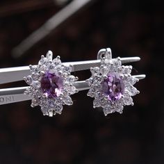 Amethyst Gemstone Earring, CZ Diamond Earring, 925 Sterling Silver Victorian Earring, Party Wear Stud Earring, Clip On Fine Earring. Manufacture Country : India * Customization always available for Ring size, metal selection and any type of center stones changes, etc.... * If you want to make your own idea of Jewelry we can do it. Material : 925 Sterling Silver Main Stone : Amethyst Secondary Gemstone : Diamond Gemstone Color :   Gemstone Shape : As Seen In A Picture Ring Size : All Size Available Weight :  * Shipment will dispatch within maximum 2-3 Days of Order done * Some Special customization can take more Time * UPS, DHL, FEDEX OR ARAMEX Will be available for Delivery Clip-on Cubic Zirconia Earrings For Anniversary, Amethyst Gemstone Earrings For Party, Purple Oval Earrings For Weddings, Elegant Purple Clip-on Earrings, Formal Silver Gemstone Hoop Earrings, Dazzling Silver Gemstone Bridal Earrings, Purple Cubic Zirconia Earrings, Amethyst Earrings For Party, Elegant Purple Dangle Clip-on Earrings