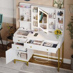 a white desk with lots of drawers and shelves