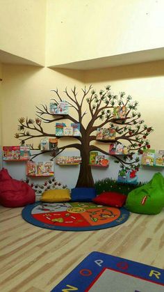 children's bookshelves and toys are on the floor in this playroom