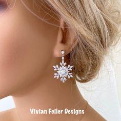 Snowflake Earrings Winter Wedding Bridal Jewelry Cubic Zirconia Sparkly Charming And Sparkle Like Diamonds! These Earrings Feature Tons Of Sparkling Clear Cubic Zirconia Stones Forming Together Given A Snowflake Like Design. Set In Beautiful Rhodium (White Gold) Finish Over Brass. They Sparkle Amazingly ! Perfect For A Winter Wedding Or Special Occasion ! Earrings Posts Are Sterling Silver. The Components Are High Quality Luster Rhodium Plated Over Brass - Tarnish Resistant, Lead Free, Nickel Fr Christmas Wedding Jewelry, Elegant Christmas Drop Earrings, Sparkling White Diamond Earrings For Wedding, White Sparkling Diamond Earrings For Wedding, Elegant Christmas Jewelry With Matching Earrings, Elegant Christmas Anniversary Earrings, Cubic Zirconia Jewelry For Christmas Anniversary, Sparkling White Gold Bridal Earrings For Wedding, Christmas Anniversary Jewelry With Cubic Zirconia