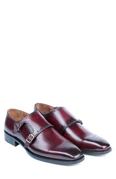 A cushioned footbed brings superior comfort to a rich leather loafer elevated by a set of buckled monk straps and delicate broguing. Leather upper, lining and sole Imported Classic Red Monk Strap Shoes For Formal Occasions, Classic Red Monk Strap Shoes For Formal Wear, Elegant Red Monk Strap Shoes With Plain Toe, Elegant Red Monk Strap Shoes For Business, Red Wingtip Dress Shoes For Work, Elegant Red Monk Strap Shoes With Round Toe, Business Casual Monk Strap Shoes With Brogue Detailing, Leather Wingtip Loafers With Buckle Closure, Red Wingtip Monk Strap Shoes For Business