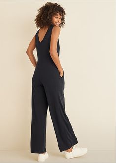 Feels like staying in, looks like going out. This easy pull-on jumpsuit was built for comfort, but has no shortage of chic details so you can step out and look stylish at a moment's notice. With a V-neck front and back plus wide legs, this relaxed-fit one-piece is surprisingly flattering and perfect for layering. Add it to your weekend rotation ASAP.  * Sizes: XS (2), S (4-6), M (8-10), L (12-14), XL (16)  * Plus sizes: 1X (18-20), 2X (22-24), 3X (26-28)  * Sleeveless  * V-neck front and back  * Wide legs  * Pockets  * 31" approx. inseam  * Polyester/rayon/spandex. Imported Solid Color V-neck Jumpsuits And Rompers For Leisure, Stretch V-neck Jumpsuits And Rompers For Loungewear, Relaxed Fit V-neck Jumpsuits And Rompers For Loungewear, Chic V-neck Relaxed Fit Jumpsuits And Rompers, Chic Stretch Jumpsuits And Rompers For Loungewear, Versatile Relaxed Fit Jumpsuits And Rompers For Loungewear, Chic Relaxed Fit Jumpsuits And Rompers For Lounging, Casual V-neck Jumpsuits And Rompers For Work, Casual V-neck Relaxed Fit Jumpsuit