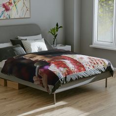 the bed is made up with an image on it