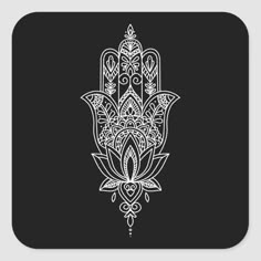 a black and white drawing of a hamsa