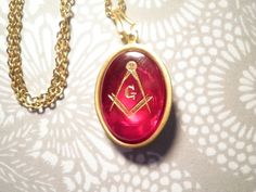 "1 red masonic 18 by 13mm stone pendant on an 18\" goldplated chain. masonic pendant necklace. item # 2034" Formal Red Medallion-shaped Jewelry, Red Medallion Necklace For Formal Occasions, Red Stone Pendant, Masonic Symbol, Masonic Symbols, Stone Pendant Necklace, Red Stone, Stone Pendant, Stone Pendants