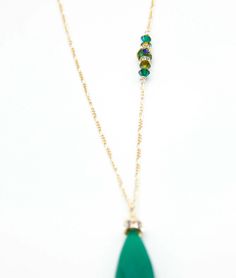 A large Emerald green Adventurine Crystal is adorned with a Swarovski Rhinestone rondelle and cap. 34”in length this amazing necklace is everyday wear or perfect for a dressy occasion. Dangles with easy movement from 14k gold fill or sterling silver. Extremely high quality chain and clasp with all closed jump rings. Side detail makes the necklace absolutely amazing, green Swarovski crystals. Available in Sterling silver or 14K gold fill chain.Custom Length available, just ask!Match with the Lind Single Strand Green Jewelry For Party, Green Single Strand Jewelry For Party, Green Faceted Necklace For Party, Elegant Green Faceted Crystal Necklaces, Green Long Necklace For Party, Green May Birthstone Long Drop Jewelry, Elegant Green Single Strand Crystal Necklaces, Green Single Strand Jewelry For Wedding, Green Single Strand Long Necklace